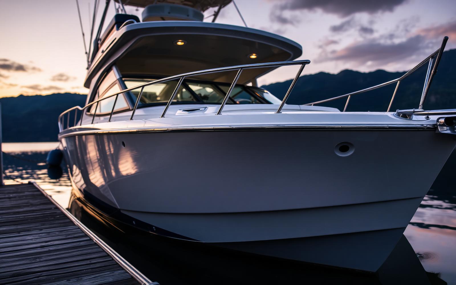 Boat hull being cleaned at a mountain lake dock