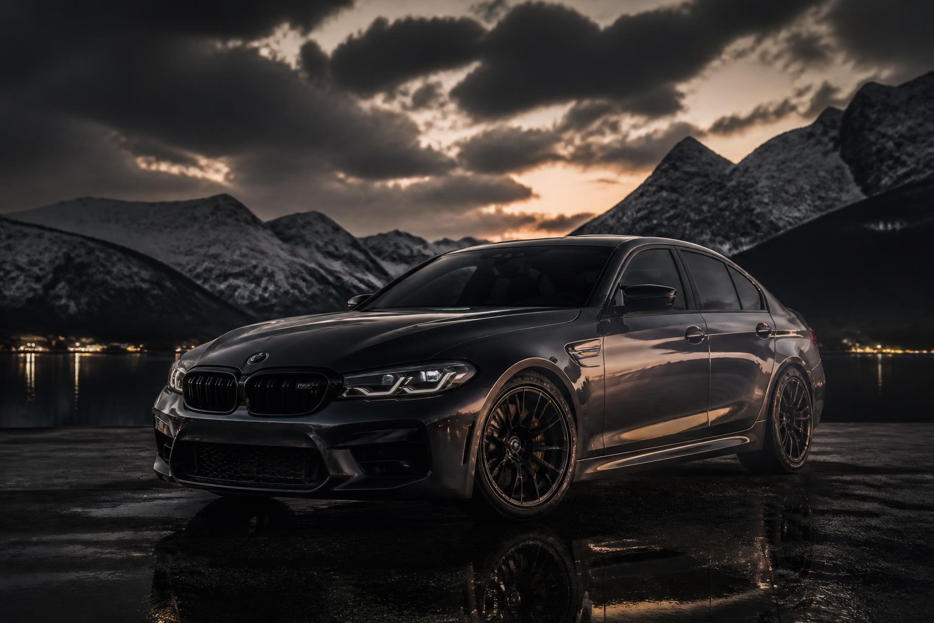 Freshly detailed dark sedan with mirror-deep paint reflections at a mountain lake