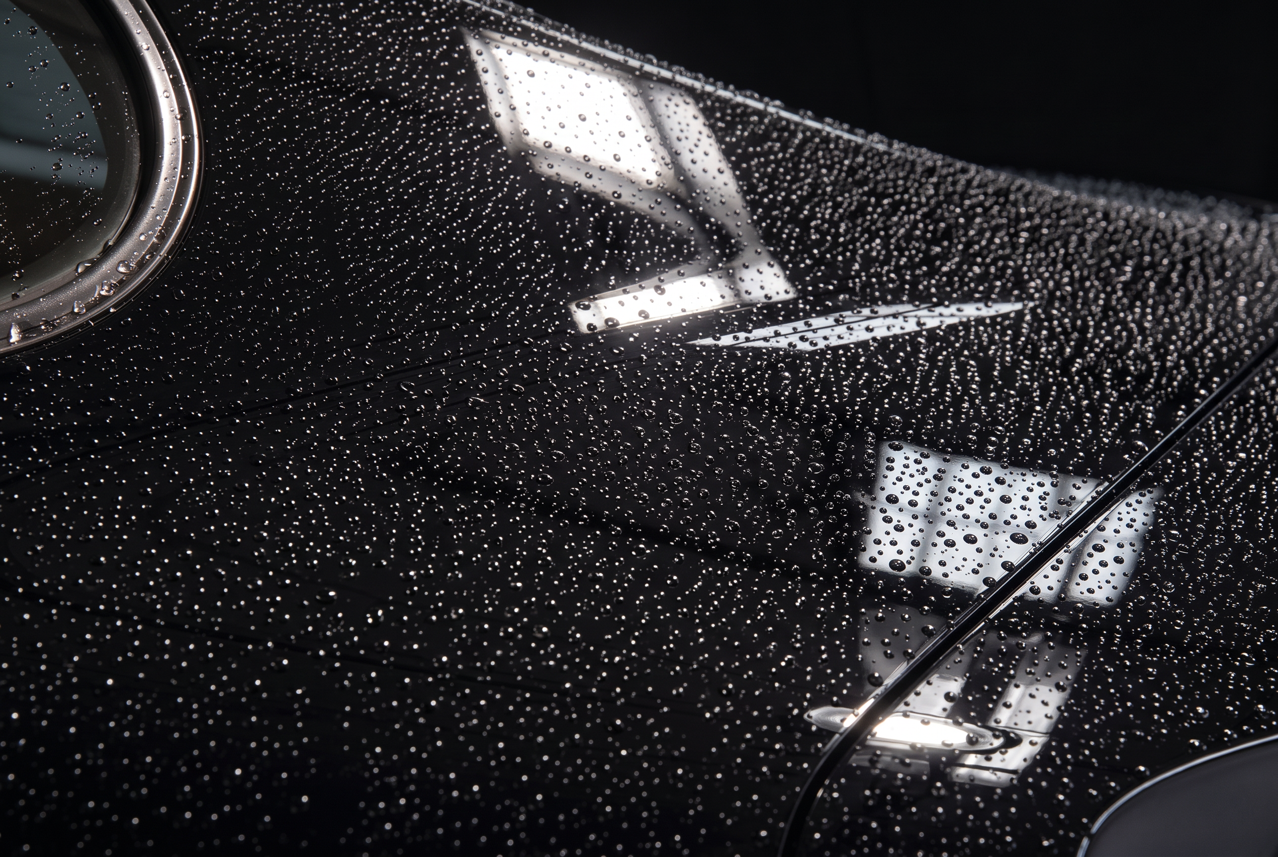 Water beading tightly on the freshly ceramic-coated panel